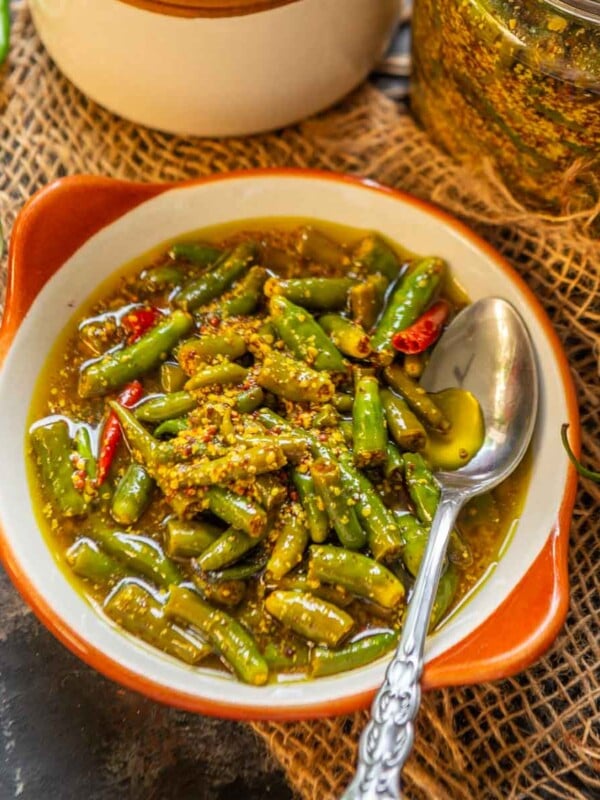 Spicy, tangy, and loaded with flavor, Green Chilli Pickle (Hari Mirch ka Achar) is a delicious North Indian style pickle recipe where fresh green chilies are pickled with mustard seeds and lime juice. Here is my mother's recipe (vegan, gluten-free).