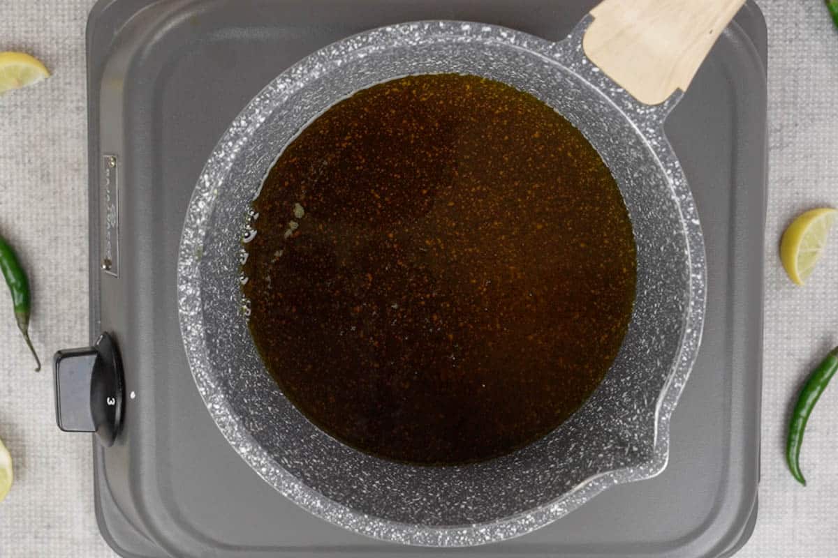 Mustard oil heating in a pan.
