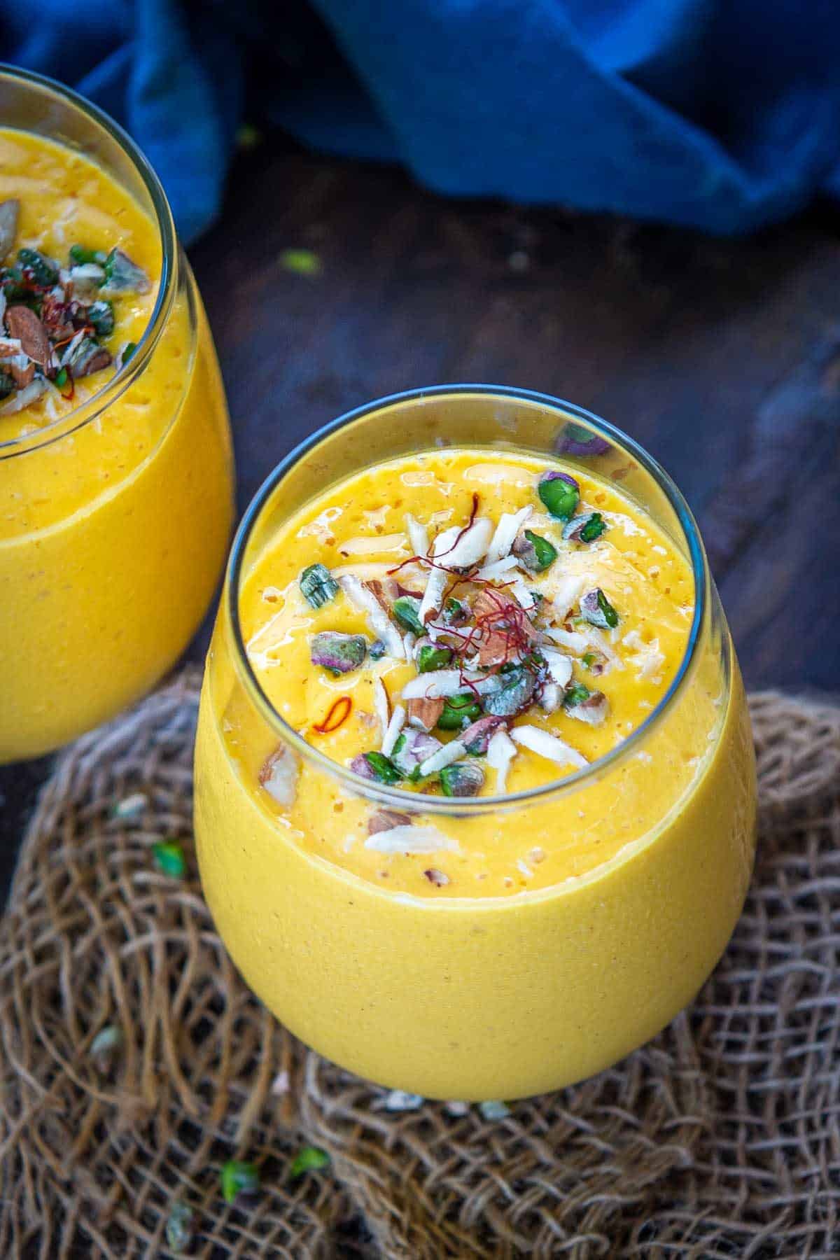 Mango lassi served in a glass.