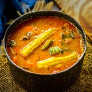 Tangy and Spicy Sambar is a South Indian staple dish that is served for all the meals including breakfast, lunch, and dinner. It is a stew of yellow lentils with vegetables and spices added to it. Here is my easy recipe to make it at home.