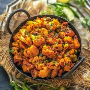 Make delicious North Indian-style Dry Aloo Gobi Matar Sabzi using my easy recipe. Serve it with dal rice or phulka for a hearty meal (vegan).