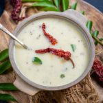 Gujarati Kadhi is a traditional yogurt-based curry that is spicy, sweet, and tangy in taste. Make it using my easy recipe in under 30 minutes and serve with steamed rice for a comforting meal (vegetarian, can be easily made gluten-free).
