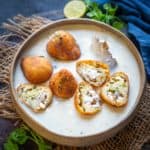 Malai kofta is a delicious Indian curry made by dunking deep-fried potato and paneer balls (kofta) in a rich velvety smooth gravy. Make perfect restaurant-style malai kofta using my tried and tested recipe. 2 styles of gravy included in the post.