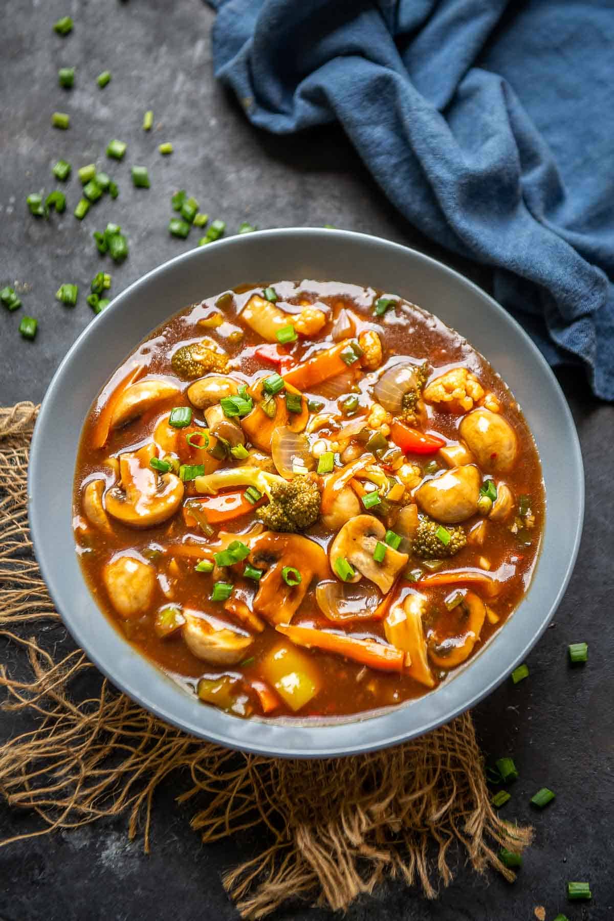 Chinese style vegetables in hot garlic sauce served in a bowl.