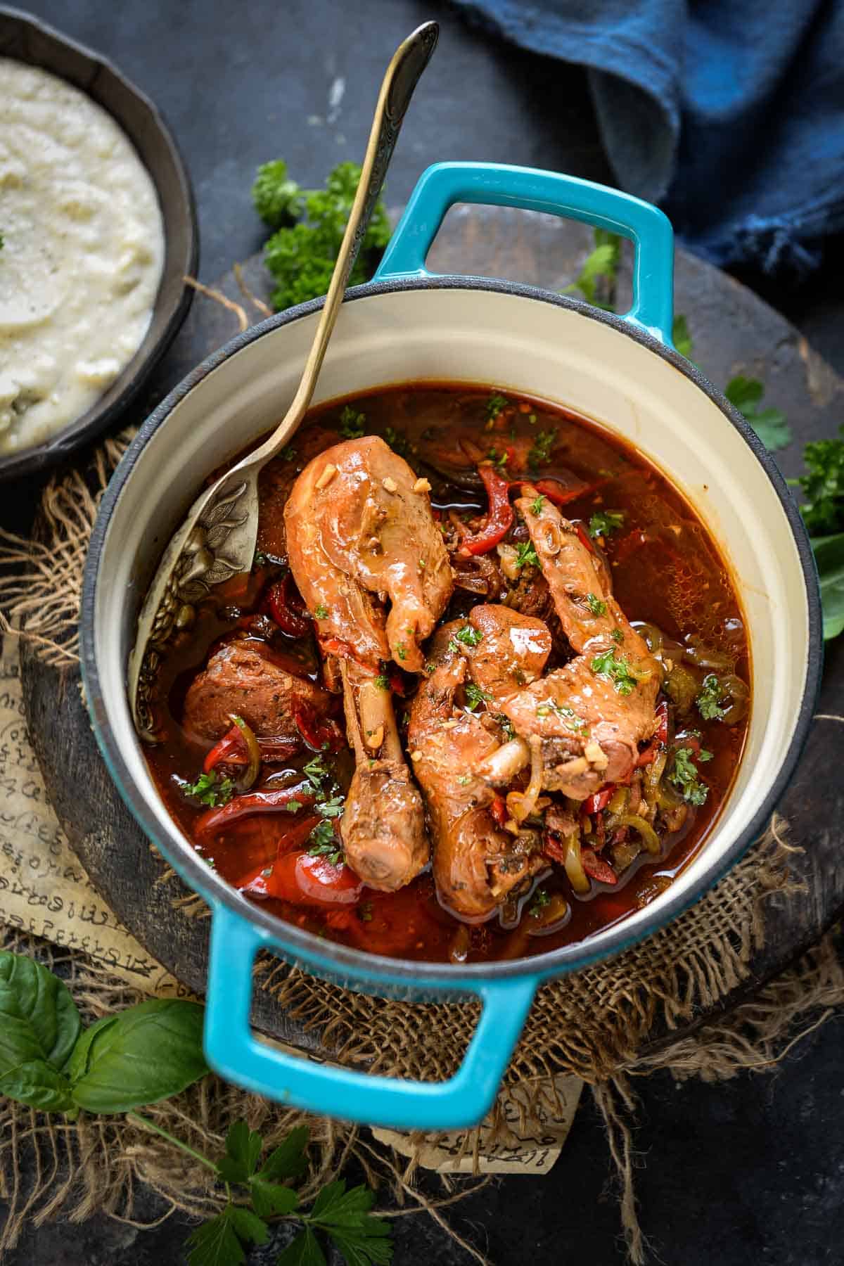 Jamaican brown stew chicken served in a pan.