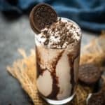 This Creamy Oreo Milkshake (Cookies and Cream Milkshake) requires 4 ingredients (no chocolate syrup) and 5 minutes from start to finish. Thick, creamy, and easy to make, this homemade shake is just what you want to sip all day (vegetarian).