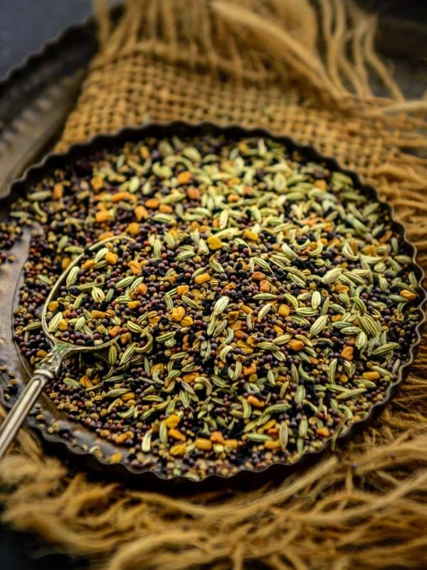 Made using 5 whole spices, Panch Phoron (Panch Phoran) is a traditional spice mix that is quintessential in Bengali cuisine. It is very easy to make at home using five basic Indian spices. Here is how to make it.