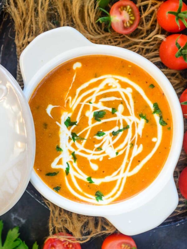 Tomato Basil Bisque is an easy-to-make creamy soup made using roasted tomatoes, heavy cream, and fresh basil. My recipe makes the best homemade version of this soup. Here is how to make it.
