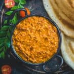 Tomato Pachadi (Thakkali Pachadi) is a delicious Andhra-style spicy and tangy tomato chutney recipe. It goes well with South Indian breakfast dishes such as idli, uttapam, dosa, and even appams. 