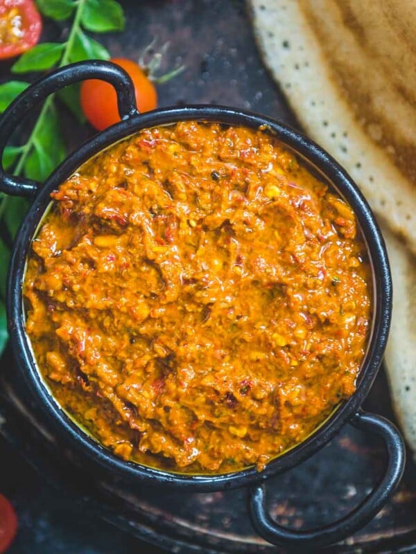 Tomato Pachadi (Thakkali Pachadi) is a delicious Andhra-style spicy and tangy tomato chutney recipe. It goes well with South Indian breakfast dishes such as idli, uttapam, dosa, and even appams. 