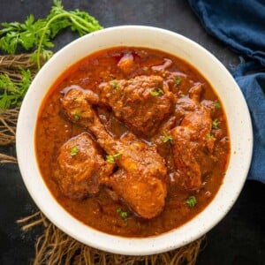 Vindaloo is a Portuguese-influenced dish made by cooking the meat with spices and vinegar. Learn to make chicken vindaloo in a traditional way using my easy recipe.