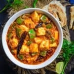 Kadai Paneer (Kadhai Paneer, Karahi Paneer) is a popular Indian curry made using paneer, onions, and green bell peppers cooked in spicy and flavorful gravy made using freshly ground kadai masala. It is one of the most popular dishes ordered in any Indian restaurant. Learn to make it at home using my easy recipe (vegetarian, gluten-free).