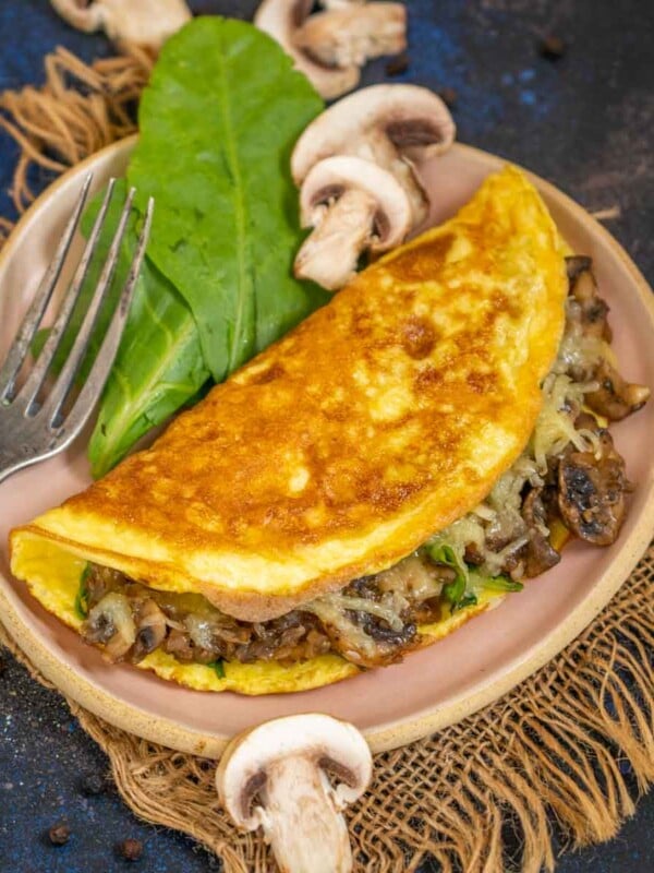 Mushroom Omelette with Spinach & Cheese is a delicious and healthy breakfast option which is super easy to make as well. Make it for a quick breakfast using my easy recipe (gluten-free).