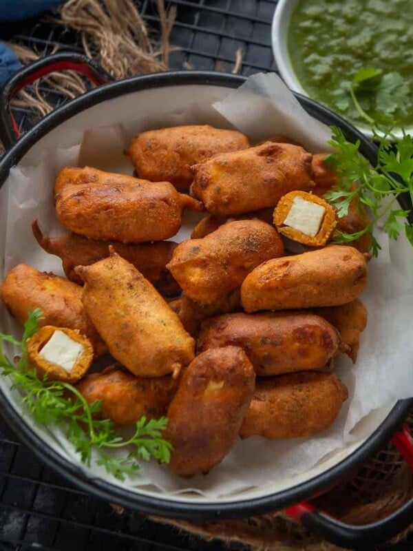Paneer Pakora is a deep-fried Indian snack made using paneer (Indian cottage cheese, Indian spices, and chickpea flour. Learn to make the best paneer pakoda using my simple and easy recipe.