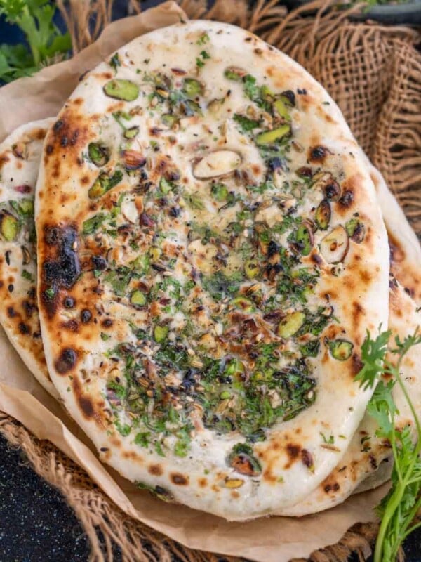 Make this mildly sweet and nutty North Indian Peshwari Naan recipe at home using my easy recipe. Serve it with a spicy curry for an indulgent meal (vegetarian).