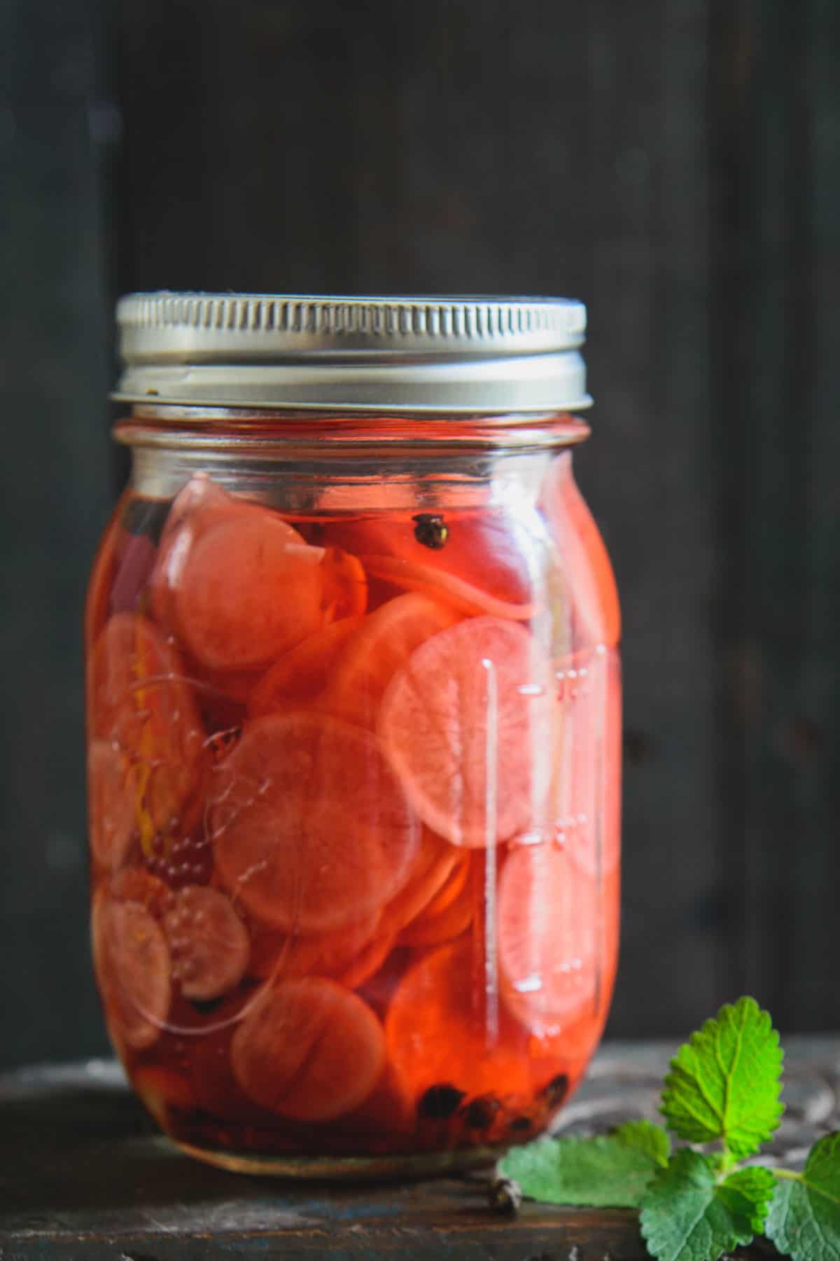 Pickled radish in a glass jar.