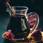 Pomegranate molasses is an essential ingredient in traditional Middle Eastern cooking, and it is made by reducing pomegranate juice. Here is how to make it at home using my simple recipe (vegan, gluten-free).