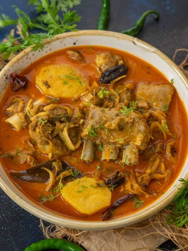 Made especially for the elite class traveling in First Class compartments of Indian railways during the pre-independence time, Railway Mutton Curry is a milder take on the spicy Indian Mutton Curry. Here is how to make it (gluten-free).