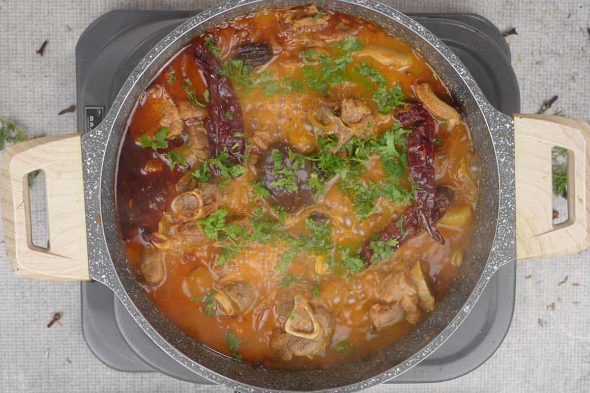 Tamarind and cilantro added to the pan.