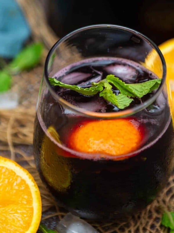 Make this refreshing Red Wine Spritzer using just 2 ingredients in 2 minutes. This easy full-bodied summer cocktail is super easy to make and great to serve for parties or get-togethers (vegan, gluten-free).