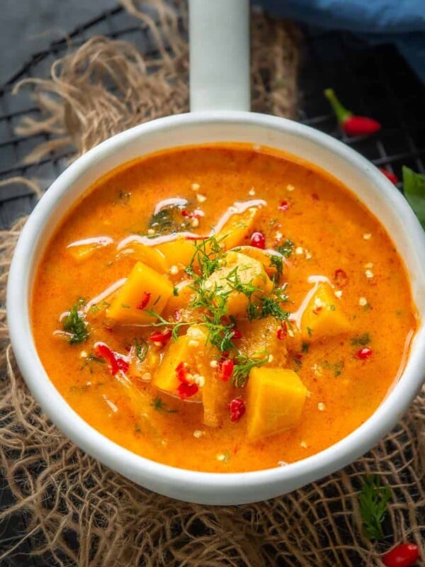 Make this spicy Thai Pumpkin Curry in under 20 minutes for your weeknight dinner. It's gluten-free, super delicious, and can be easily made vegan too. Here is how to make it.