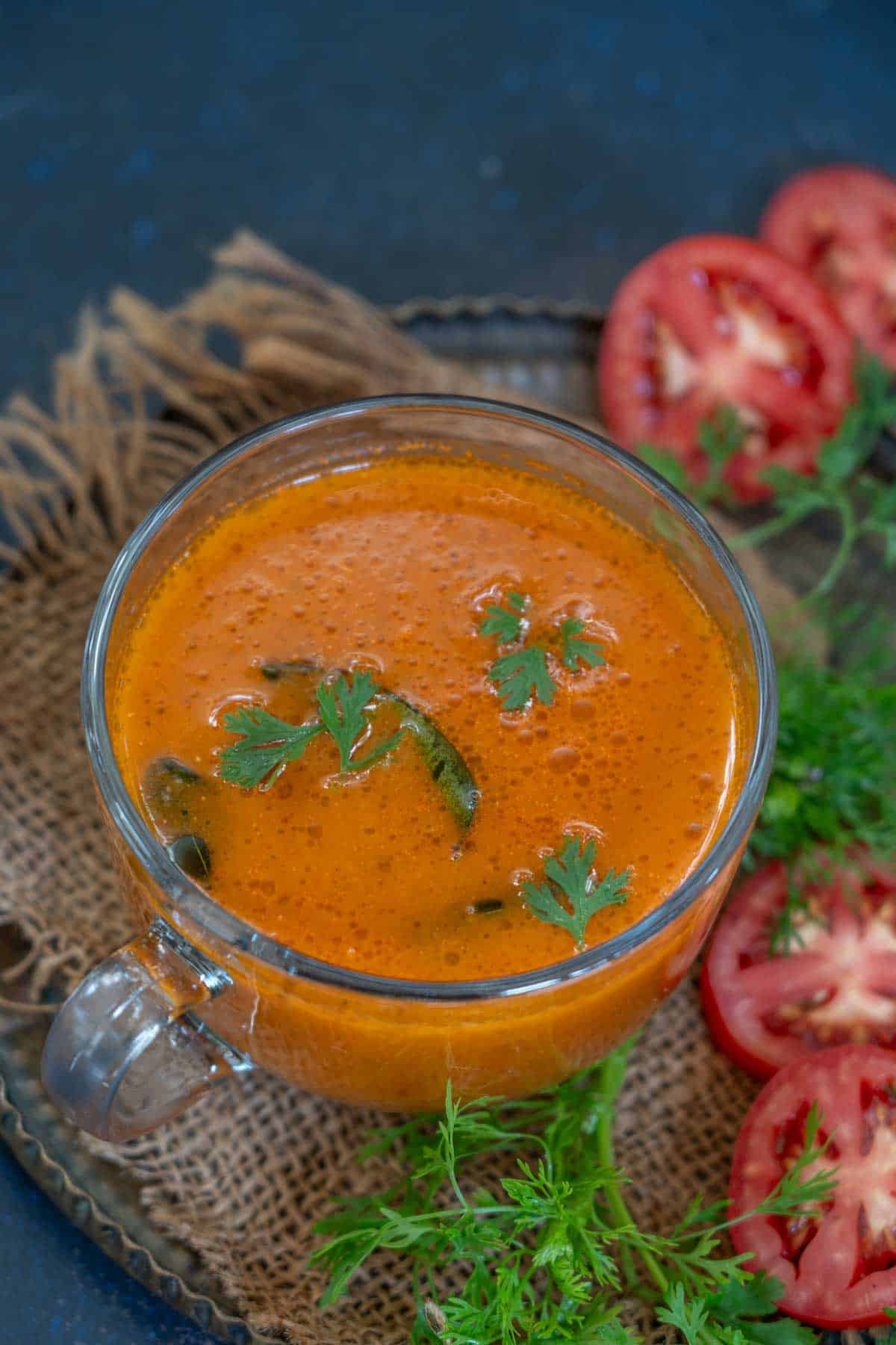 Tomato shorba served in a cup.