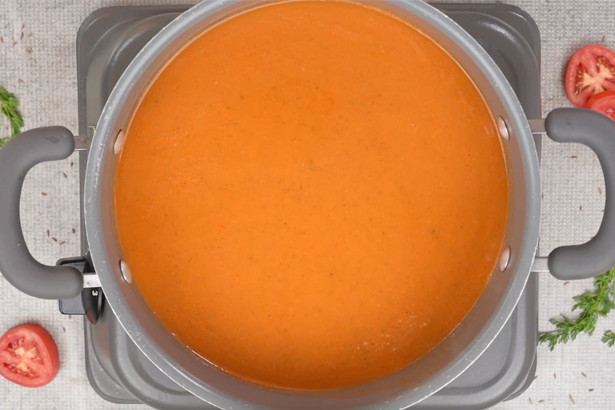 Tomato mixture added back to the pan.