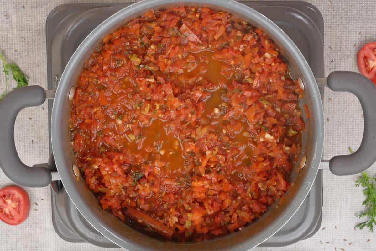 Bay leaves discarded from cooled tomato mixture.