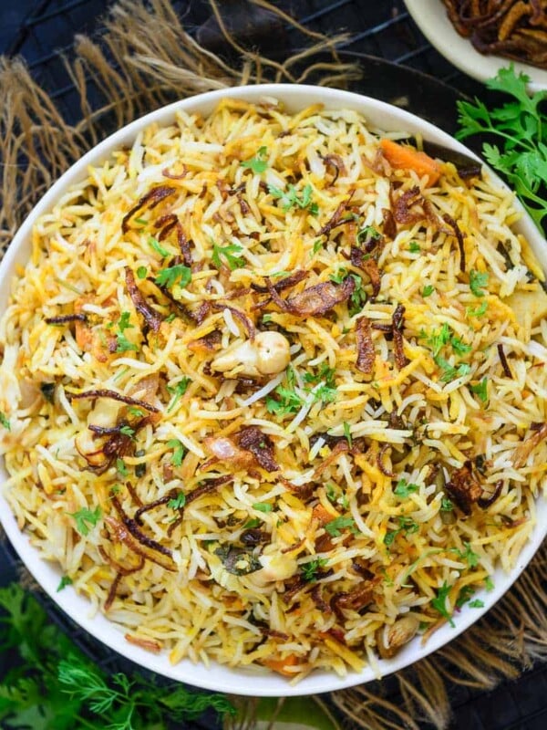 Hyderabadi Veg Biryani or Vegetable Biryani is a delicious medley of succulent vegetables, spices, ghee, saffron, and flavourful basmati rice which no one can resist. The best part is you can make a great restaurant-style version at home easily. Here is how to make it.