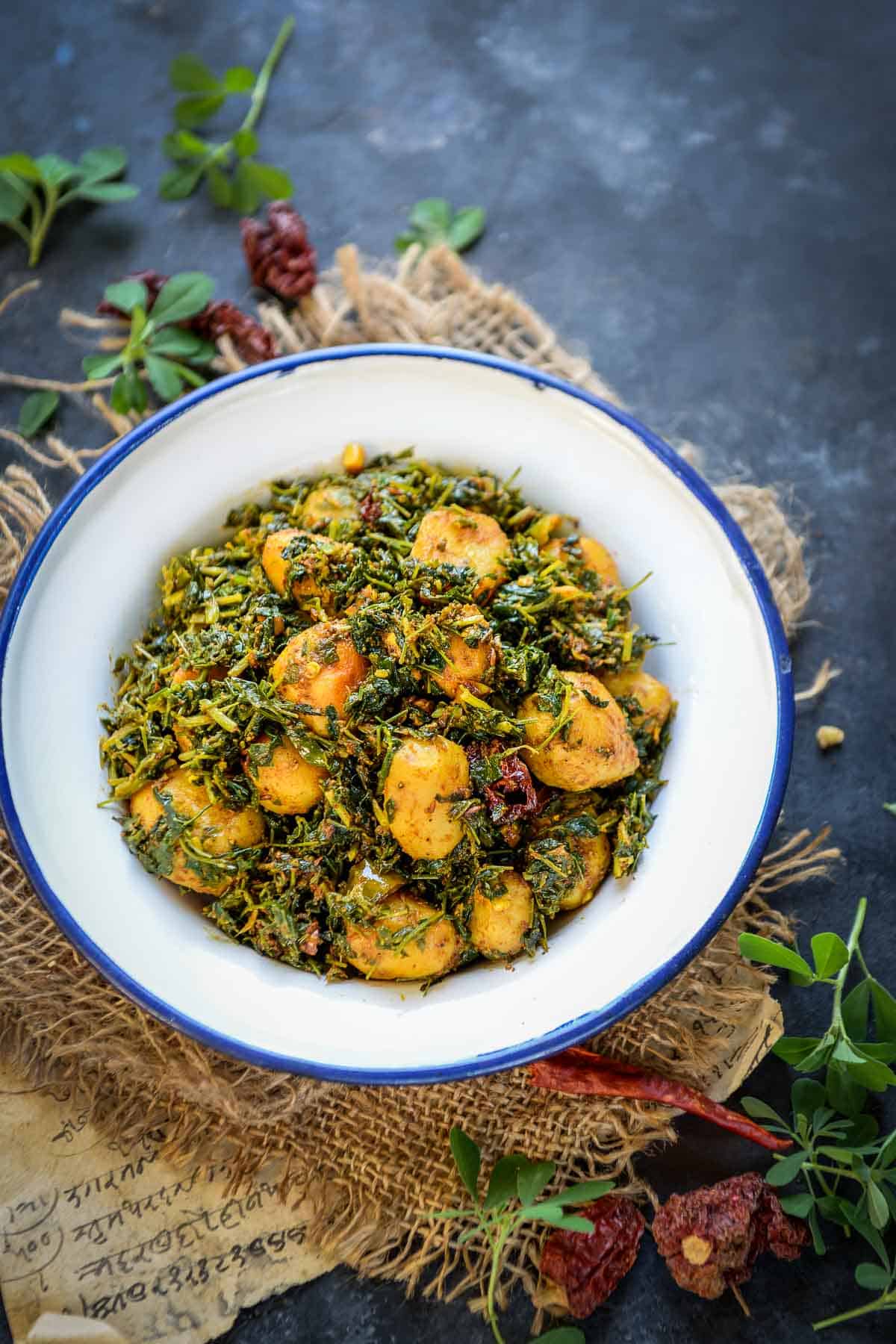 Aloo methi served in a bowl.