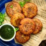 Crispy & crunchy, aloo tikki is a popular North Indian street food made using potatoes. Potatoes are mixed with herbs and spices, made into patties, and fried until crispy. It is one of the most popular chaat items and can be made easily at home.
