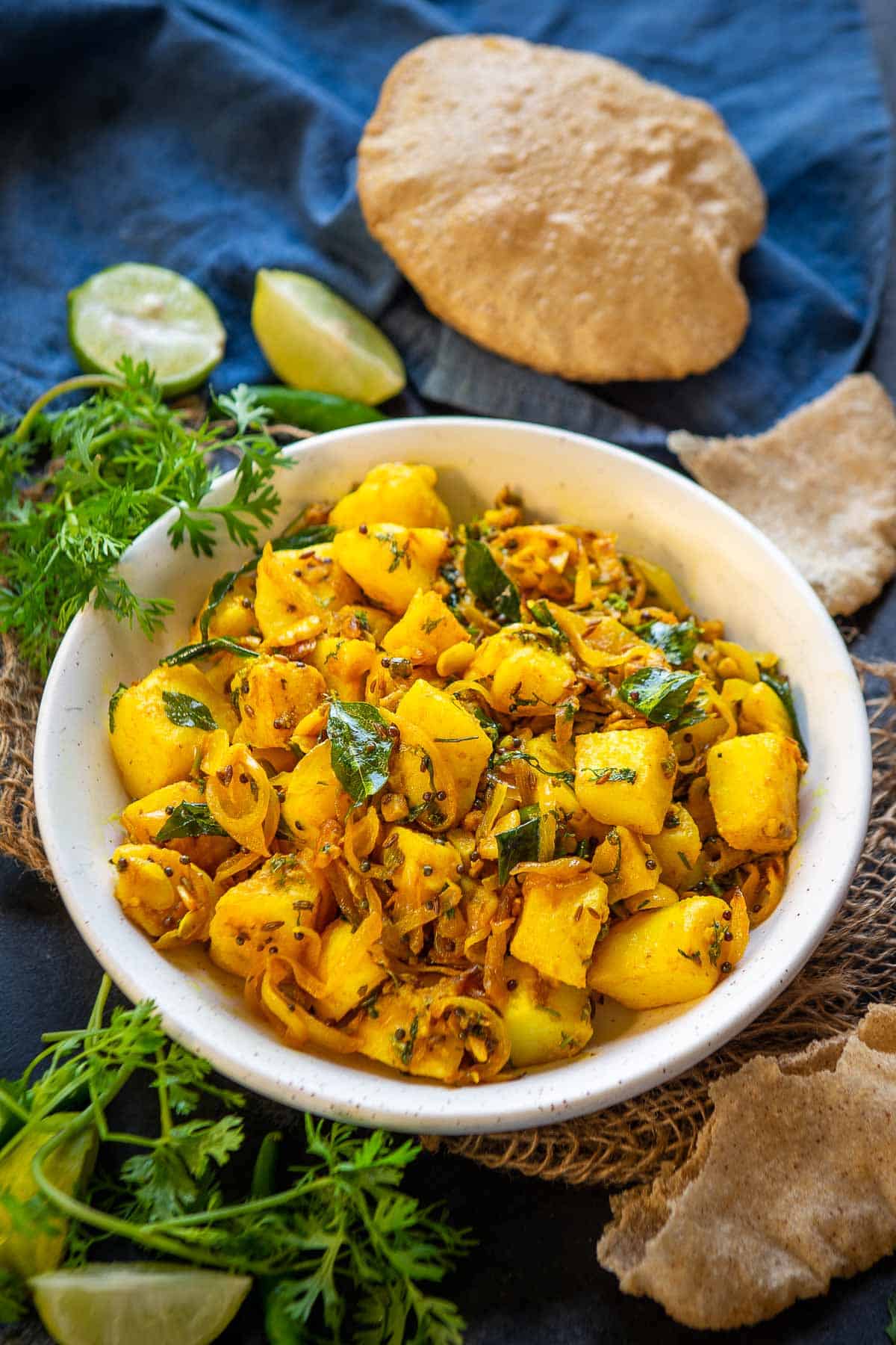 Maharashtrian Potato Bhaji (Batata Bhaji) served in a bowl.