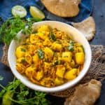 Batata Bhaji (Maharashtrian Potato Bhaji) is a dry side dish (sabji) from Maharashtrian cuisine. It is made using potatoes and basic Indian spices and pairs well with puri, chapati, and pav.