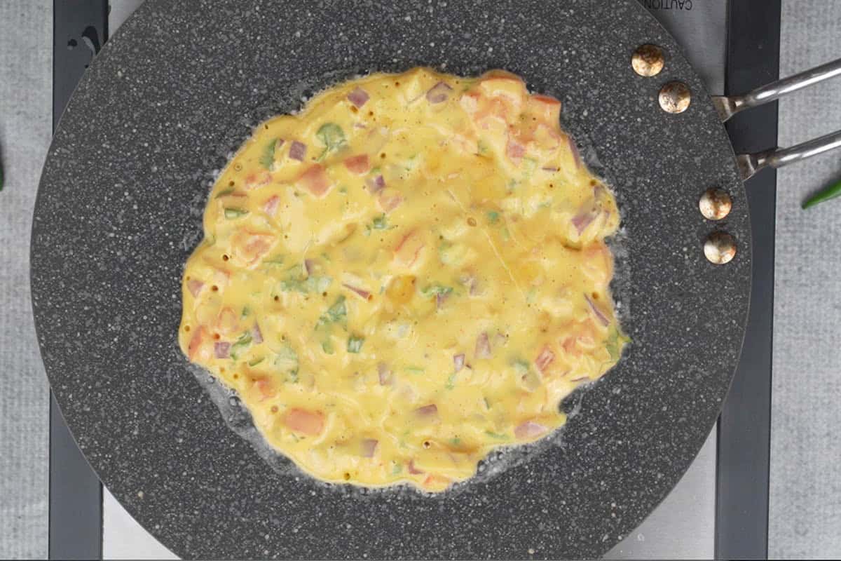 Oil poured on the sides of the chilla.