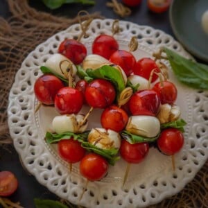 These Italian Tomato-Mozzarella Caprese Skewers are easy and quick appetizer which you can make ahead of the party. Check out the easy recipe.