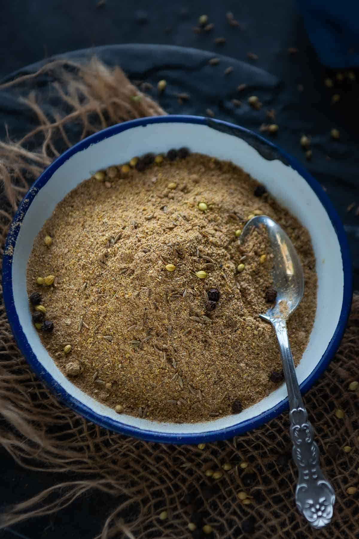 Chaat masala powder kept in a bowl.