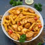 This Easy Cajun Jambalaya Pasta (Pastalaya) is bursting with deep Louisiana flavors and comes together in just 30 minutes. This pasta dish is loaded with shrimp, sausages, veggies, and a pre-made cajun spice mix. Try it!