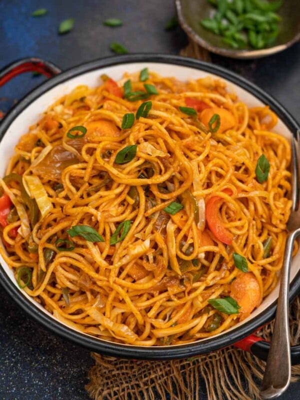 Stir-fried noodles with kimchi and a spicy Korean sauce, these addictive and spicy Quick Kimchi Noodles come together in under 30 minutes using a few simple ingredients. Make these vegan, add chicken, shrimp, or bacon, or top with an egg.