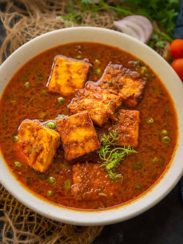 Made using fresh paneer and green peas, matar paneer is one of the most popular Indian curries. This creamy and spicy curry is made by simmering peas and paneer in an onion-tomato-based gravy. Make it for special occasions or everyday meals, it's going to be a hit always (gluten-free, can be made vegan)