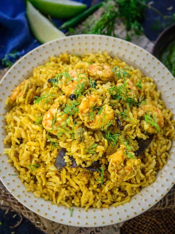 Shrimp Pulao (Prawn Pulao) is a delicious one-pot Indian rice dish made using rice, shrimp, herbs, and spices. Make it at home using my easy recipe.