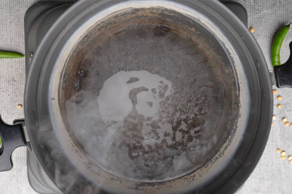 Water boiling in a idli pan.
