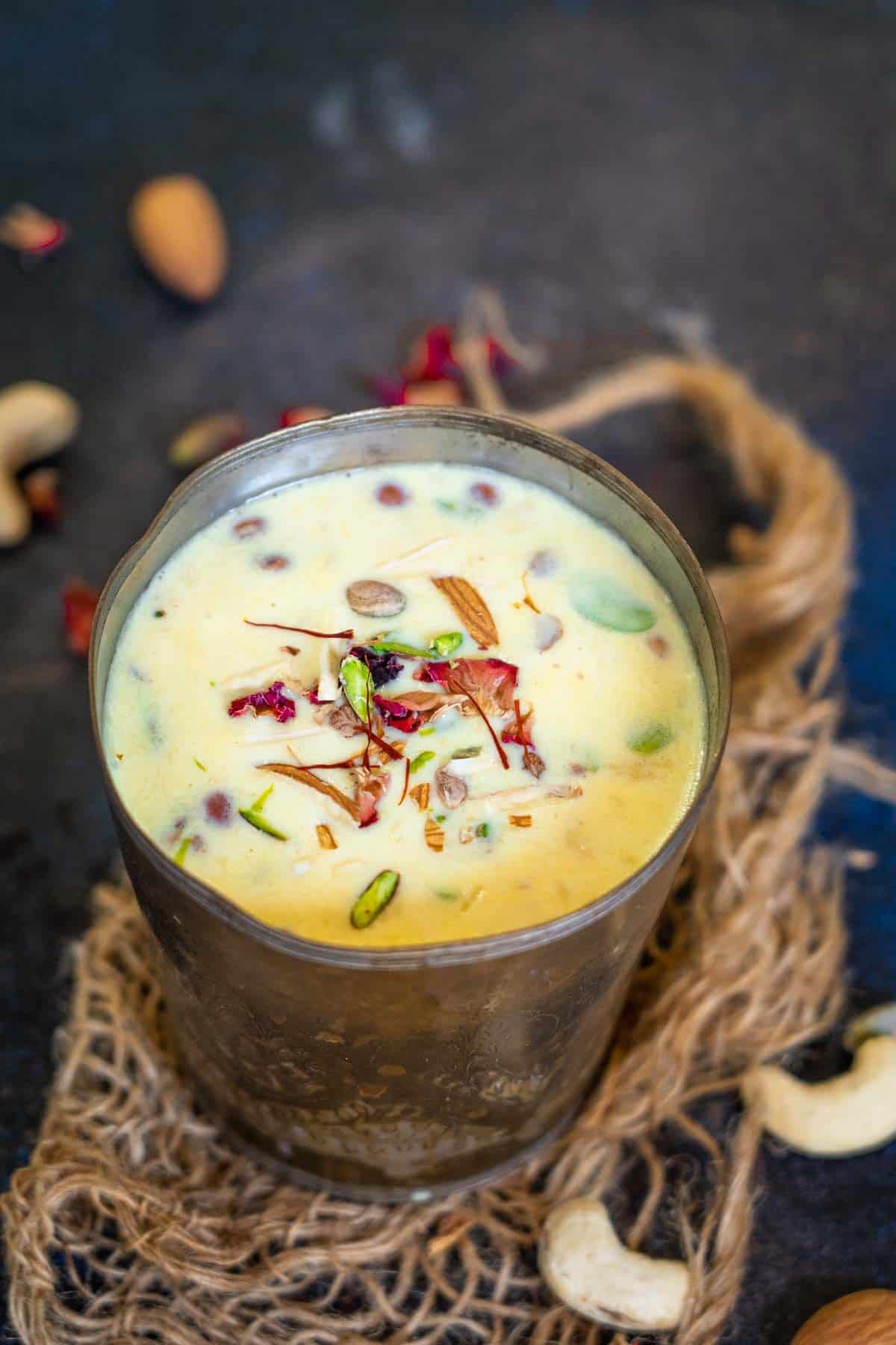 Saffron milk served in a glass.