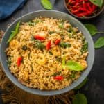 This authentic Thai Fried Rice (Khao Pad) is super easy to make and comes together in under 30 minutes. Try this easy recipe and serve it as a side dish or main course.
