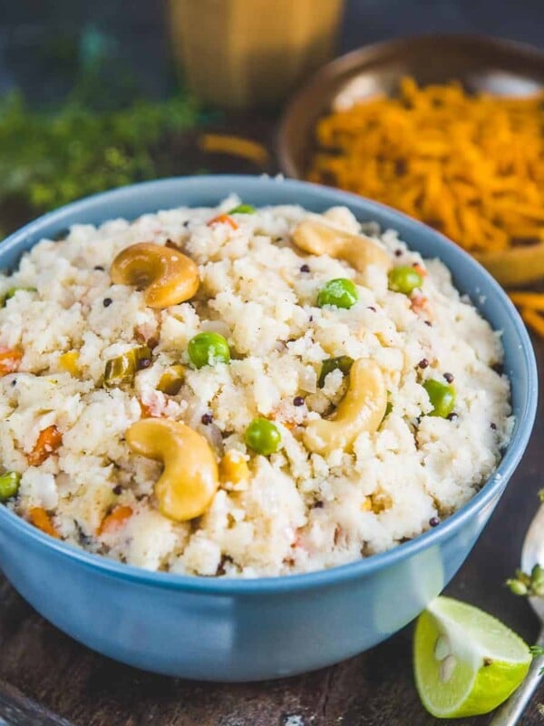 Vegetable Rava Upma (Sooji Upma, Savory Semolina Porridge) is a popular Indian breakfast dish made using fine semolina, onions, mild spices, and a few more ingredients. It is filling and nutritious and comes together in under 20 minutes. My recipe makes the best fluffy and non-sticky upma in a jiffy (vegetarian).
