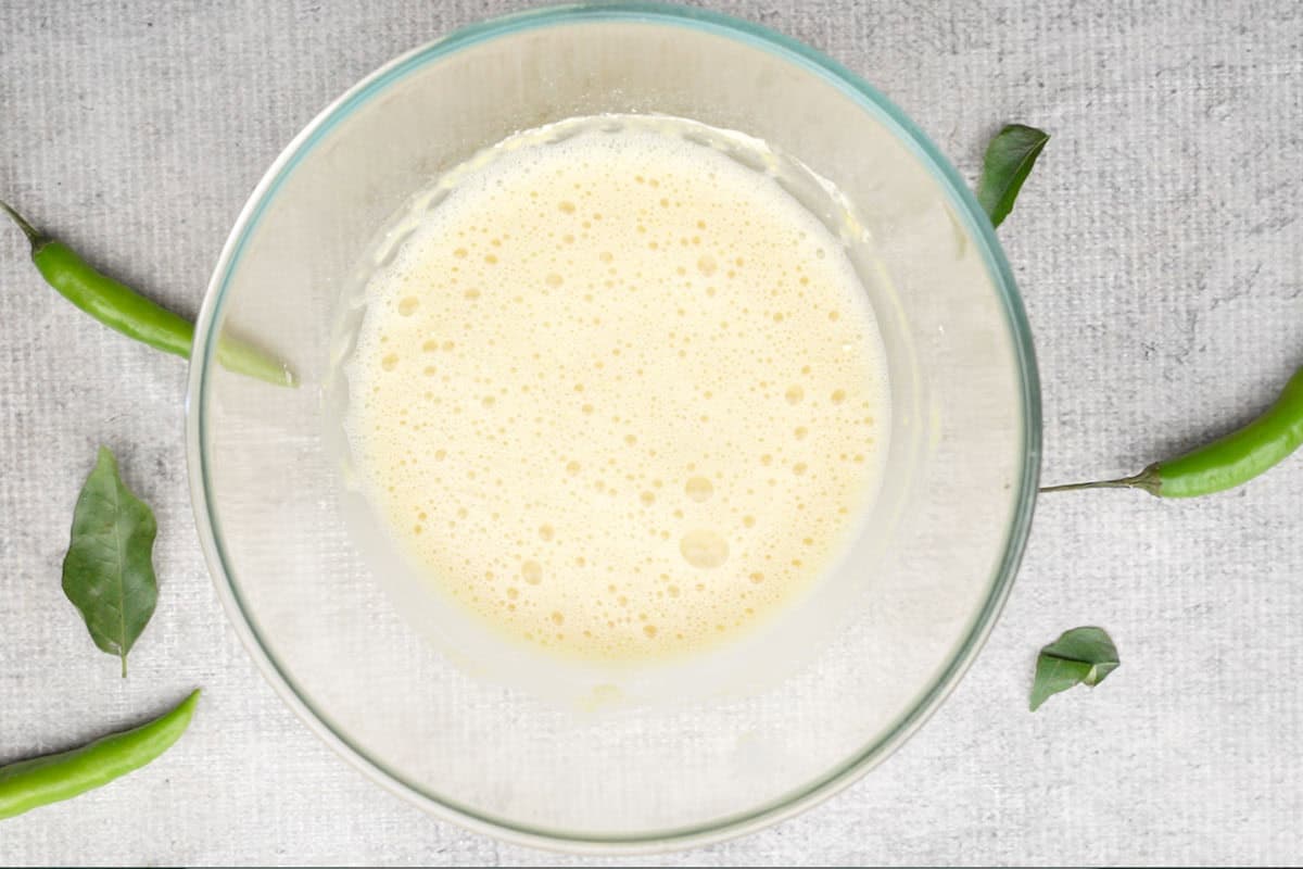 Besan and water mixture made in a bowl.
