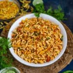 Kolkata Street Style Jhal Muri (Spicy Puffed Rice) is a popular street food of Kolkata made using puffed rice, onions, tomatoes, and a few other ingredients. Raw mustard oil gives it a very unique flavor (vegan).