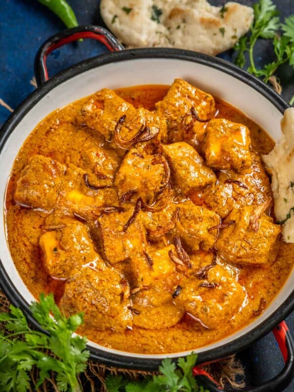 Paneer Korma is a Mughlai-style paneer dish where paneer cubes are cooked in rich onion-based gravy. This Indian curry is rich and creamy and goes well with Indian bread (vegetarian, gluten-free).