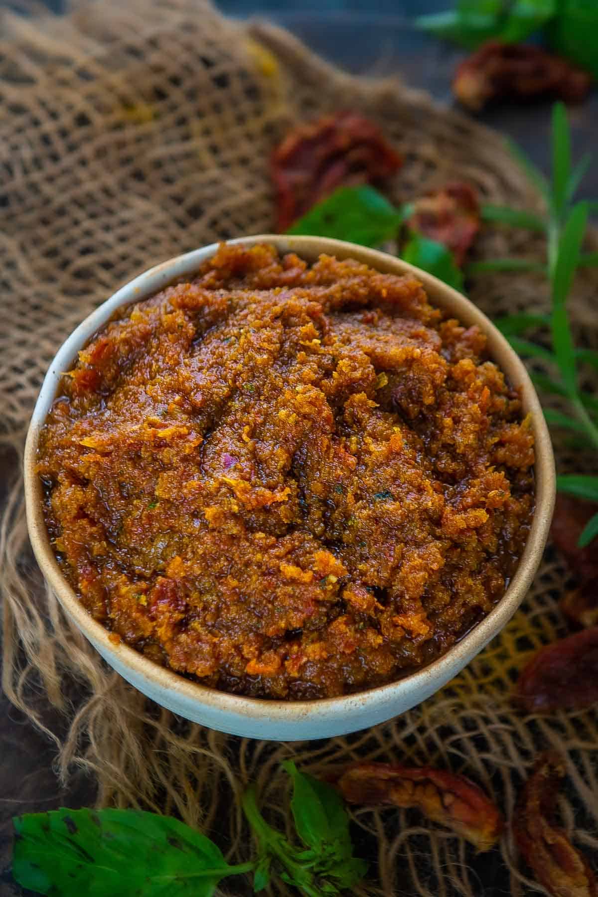 Homemade sun dried tomato pesto sauce served in a bowl.