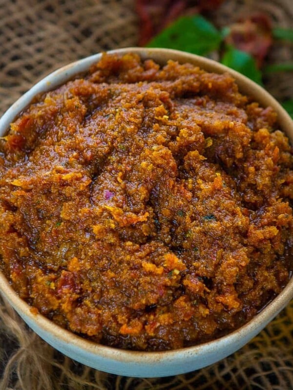 This Homemade Sun-Dried Tomato Pesto Sauce (Pesto Rosso, Red Pesto) is a Sicilian variation of the traditional basil pesto. It comes together in just 5 minutes and uses a handful of ingredients.