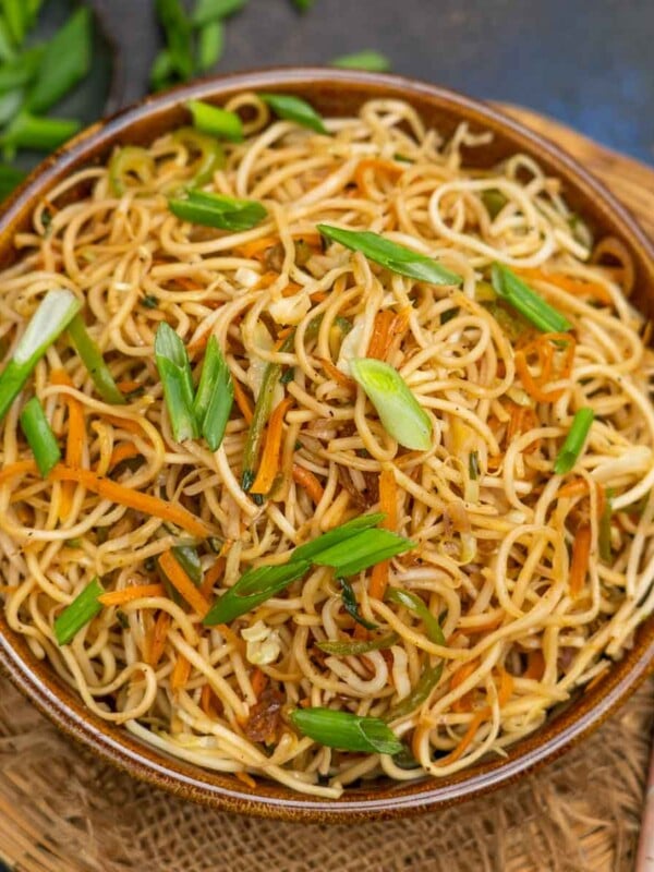 Make Indo-Chinese takeout copycat Veg Hakka Noodles at home using my easy recipe. They come together in under 30 minutes using simple ingredients (vegan).